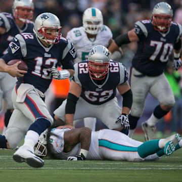 New England Patriots quarterback Tom Brady (12) runs for a first down on a fourth down play in the fourth quarter at Gillette Stadium in Foxboro, Massachusetts on October 27, 2013. (Allen Eyestone/The Palm Beach Post)

Miami Dolphins Vs New England Patriots