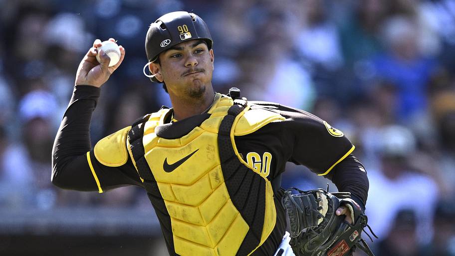San Diego Padres catcher Ethan Salas throws to first base