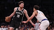Apr 13, 2025; Brooklyn, New York, USA; Brooklyn Nets forward Drew Timme (26) is guarded by New York Knicks forward Kevin McCullar Jr. (9) during the second half at Barclays Center. Mandatory Credit: Vincent Carchietta-Imagn Images