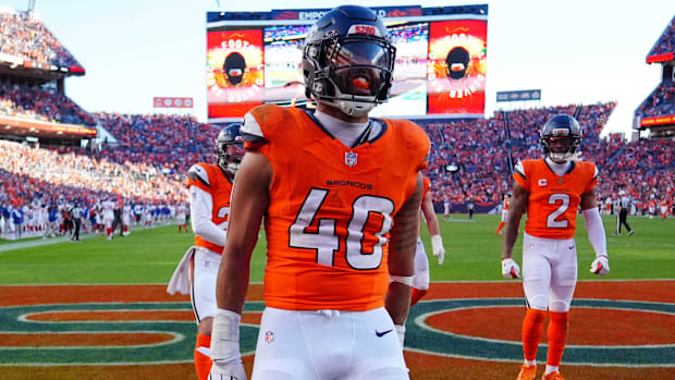 Denver Broncos linebacker Justin Strnad (40) celebrates after a touchdown during the second half against the New York Giants.