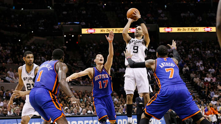 Mar 7, 2012; San Antonio, TX, USA; San Antonio Spurs guard Tony Parker (9) shoots between New York Knicks guard Jeremy Lin (17) and forward Carmelo Anthony (7) during the first half at the AT&T Center.