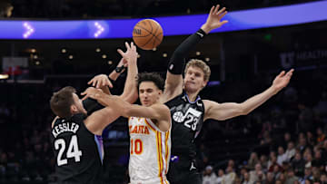 Jan 7, 2025; Salt Lake City, Utah, USA;  Utah Jazz center Walker Kessler (24) and forward Lauri Markkanen (23) try to keep the ball from Atlanta Hawks forward Zaccharie Risacher (10) during the first quarter at Delta Center. Mandatory Credit: Chris Nicoll-Imagn Images