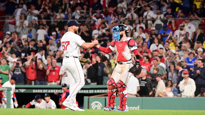 Jun 16, 2024; Boston, Massachusetts, USA; Boston Red Sox relief pitcher Greg Weissert (57) and catcher Connor Wong (12) celebrate beating the New York Yankees at Fenway Park. Mandatory Credit: Eric Canha-USA TODAY Sports