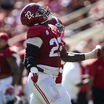 Oct 12, 2024; Tuscaloosa, Alabama, USA; Alabama Crimson Tide defensive back Malachi Moore (13), lineman LT Overton (22), and defensive back Jaylen Mbakwe (9) react to recovering a fumble by the South Carolina Gamecocks during the fourth quarter at Bryant-Denny Stadium. Mandatory Credit: Will McLelland-Imagn Images