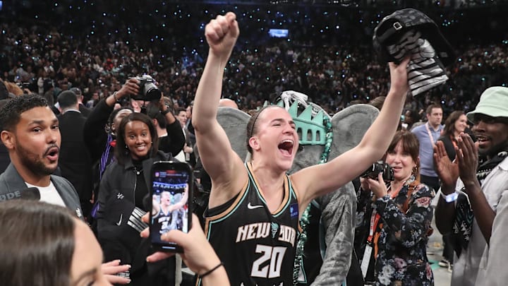 Liberty guard Sabrina Ionescu celebrates after defeating the Lynx in overtime to win the 2024 WNBA Finals.