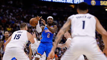 May 15, 2025; Denver, Colorado, USA; Oklahoma City Thunder guard Shai Gilgeous-Alexander (2) loses control of the ball against Denver Nuggets center Nikola Jokic (15) and guard Christian Braun (0) as forward Michael Porter Jr. (1) defends in the second quarter during game six of the second round for the 2025 NBA Playoffs at Ball Arena. Mandatory Credit: Isaiah J. Downing-Imagn Images