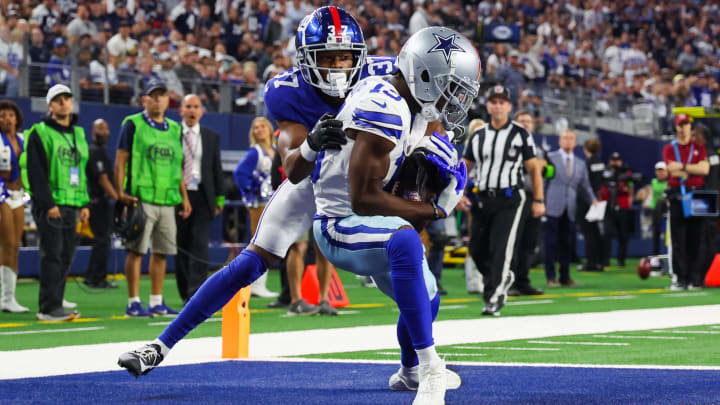 Nov 12, 2023; Arlington, Texas, USA;  Dallas Cowboys wide receiver Michael Gallup (13) makes a touchdown  catch past New York Giants cornerback Tre Hawkins III (37) during the second half at AT&T Stadium. Mandatory Credit: Kevin Jairaj-USA TODAY Sports