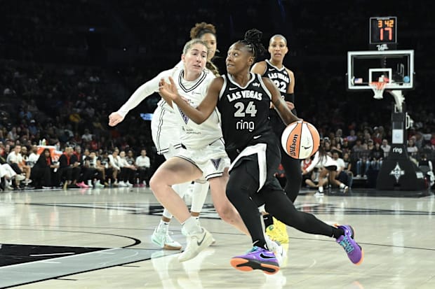 Aces guard Jewell Loyd drives past Golden State Valkyries guard Kate Martin