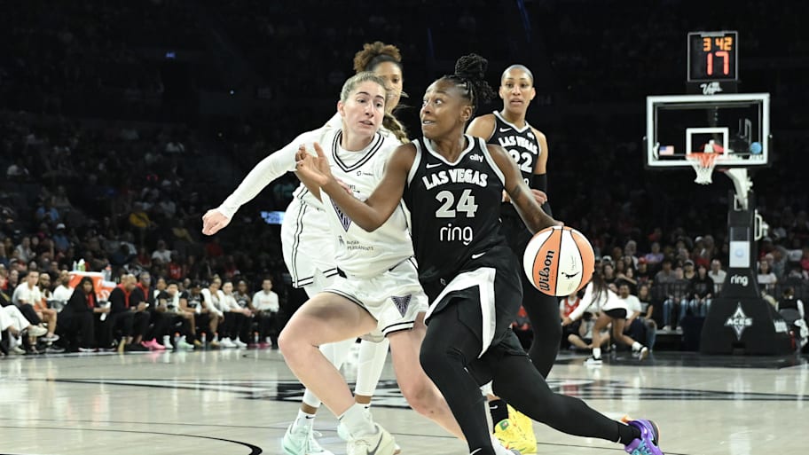 Aces guard Jewell Loyd drives past Golden State Valkyries guard Kate Martin