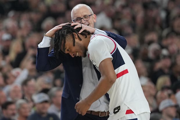 Connecticut Huskies coach Dan Hurley celebrates with guard Stephon Castle in the second half against the Purdue Boilermakers.