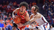 Jan 23, 2025; Champaign, Illinois, USA;  Maryland Terrapins guard Ja'Kobi Gillespie (0) drives to the basket as Illinois Fighting Illini guard Dra Gibbs-Lawhorn (2) defends during the second half at State Farm Center. Mandatory Credit: Ron Johnson-Imagn Images