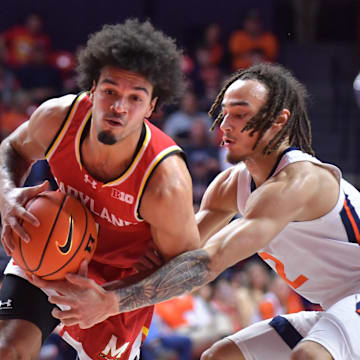 Jan 23, 2025; Champaign, Illinois, USA;  Maryland Terrapins guard Ja'Kobi Gillespie (0) drives to the basket as Illinois Fighting Illini guard Dra Gibbs-Lawhorn (2) defends during the second half at State Farm Center. Mandatory Credit: Ron Johnson-Imagn Images