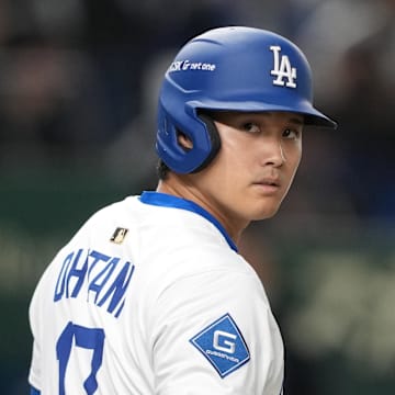 Mar 16, 2025; Bunkyo, Tokyo, Japan; Los Angeles Dodgers designated hitter Shohei Ohtani (17) waits to bat during the first inning against the Hanshin Tigers at Tokyo Dome. Mandatory Credit: Darren Yamashita-Imagn Images