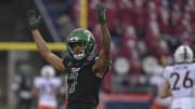 Dec 27, 2023; Annapolis, MD, USA;  Tulane Green Wave defensive back Lance Robinson (7) reacts after linebacker Tyler Grubbs (not pictured) scores a touchdown after recovering a Virginia Tech Hokies fumble during the first quarter at Navy-Marine Corps Memorial Stadium. 