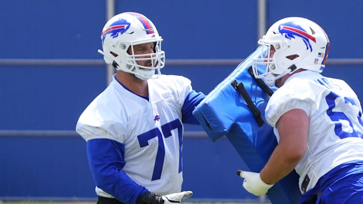 Jun 13, 2023; Buffalo, NY, USA; Buffalo Bills tackle / guard David Quessenberry (77) participates in blocking drills during Buffalo Bills Minicamp. Mandatory Credit: Gregory Fisher-Imagn Images