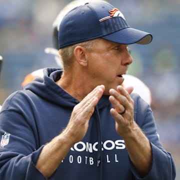 Sep 8, 2024; Seattle, Washington, USA; Denver Broncos head coach Sean Payton watches pregame warmups against the Seattle Seahawks at Lumen Field. 