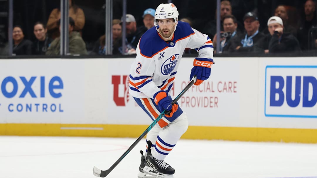 Apr 7, 2026; Salt Lake City, Utah, USA; Edmonton Oilers defenseman Evan Bouchard (2) skates with the puck against the Utah Mammoth during overtime at Delta Center. Mandatory Credit: Rob Gray-Imagn Images