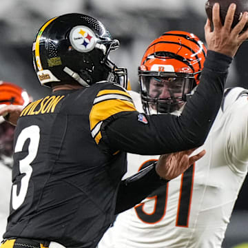 Jan 4, 2025; Pittsburgh, Pennsylvania, USA; Cincinnati Bengals defensive end Trey Hendrickson (91) pressures Pittsburgh Steelers quarterback Russell Wilson (3) in the first quarter at Acrisure Stadium. Mandatory Credit: Sam Greene/USA TODAY Network via Imagn Images