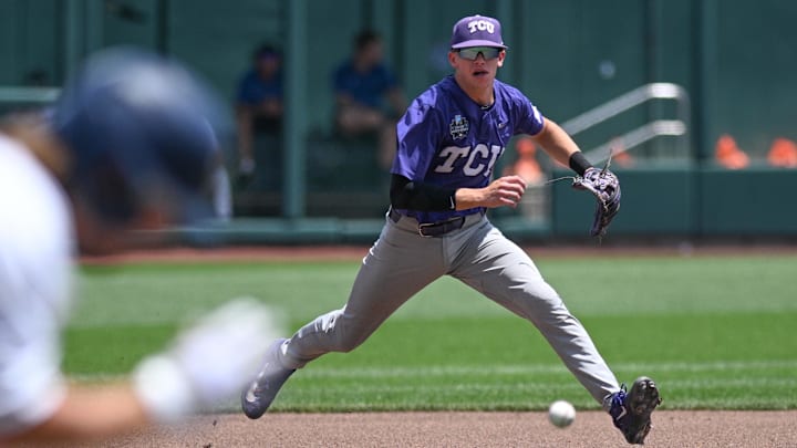 Omaha, NE, USA; TCU Horned Frogs third baseman Brayden Taylor (55) fields a ground ball against the Oral Roberts Golden Eagles in the second inning at Charles Schwab Field Omaha. Omaha, NE, USA; TCU Horned Frogs third baseman Brayden Taylor (55) fields a ground ball against the Oral Roberts Golden Eagles in the second inning at Charles Schwab Field Omaha.