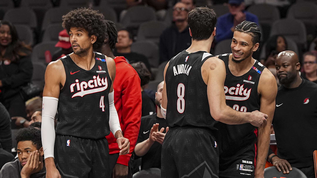 Apr 1, 2025; Atlanta, Georgia, USA; Portland Trail Blazers guard Matisse Thybulle (4) and forwards Deni Avdija (8) and  Toumani Camara (33) react late in the game against the Atlanta Hawks during the second half at State Farm Arena. Mandatory Credit: Dale Zanine-Imagn Images
