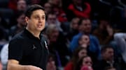 Cincinnati Bearcats head coach Wes Miller speaks to his players in the second half of the NCAA basketball game between Cincinnati Bearcats and Evansville Purple Aces at Fifth Third Arena in Cincinnati on Friday, Dec. 29, 2023.