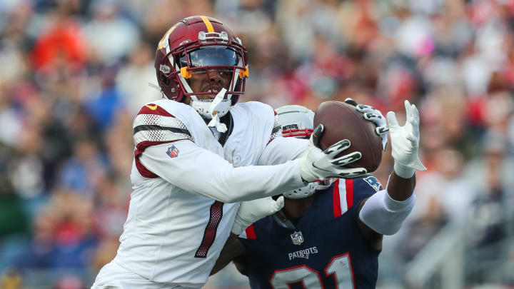 Nov 5, 2023; Foxborough, Massachusetts, USA; Washington Commanders receiver Jahan Dotson (1) catches a pass for a touchdown during the second half against the New England Patriots at Gillette Stadium. Mandatory Credit: Paul Rutherford-USA TODAY Sports