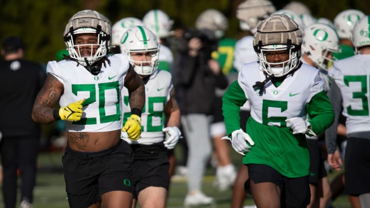 Oregon running backs Jordan James, left, and Noah Whittington work out during spring camp for the Oregon Ducks Thursday, March 14, 2024.