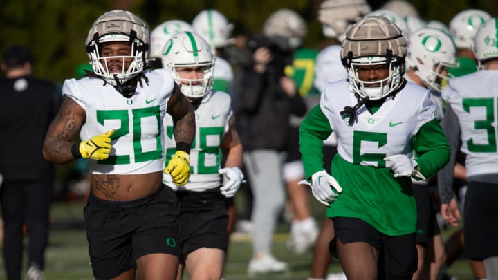 Oregon running backs Jordan James, left, and Noah Whittington work out during spring camp for the Oregon Ducks Thursday, March 14, 2024.