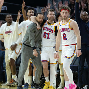 Mar 18, 2025; San Francisco, California, USA; The Golden State Warriors bench celebrates a 3-point basket against the Milwaukee Bucks during the fourth quarter at Chase Center. Mandatory Credit: D. Ross Cameron-Imagn Images