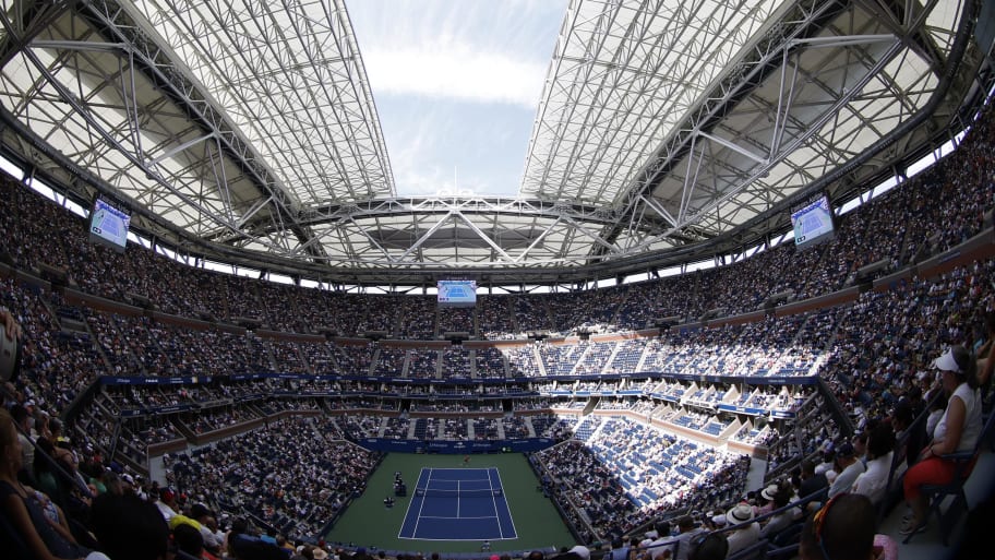 The partially closed roof at Arthur Ashe provides some much-needed shade.