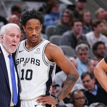 Dec 19, 2019; San Antonio, TX, USA; San Antonio Spurs head coach Gregg Popovich talks with guard DeMar DeRozan (10) during the second half against the Brooklyn Nets at the AT&T Center. Mandatory Credit: Daniel Dunn-Imagn Images