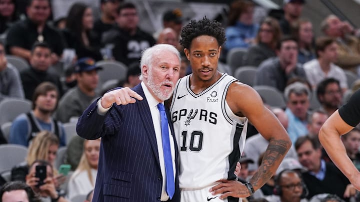 Dec 19, 2019; San Antonio, TX, USA; San Antonio Spurs head coach Gregg Popovich talks with guard DeMar DeRozan (10) during the second half against the Brooklyn Nets at the AT&T Center. Mandatory Credit: Daniel Dunn-Imagn Images