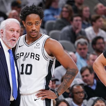 Dec 19, 2019; San Antonio, TX, USA; San Antonio Spurs head coach Gregg Popovich talks with guard DeMar DeRozan (10) during the second half against the Brooklyn Nets at the AT&T Center. 