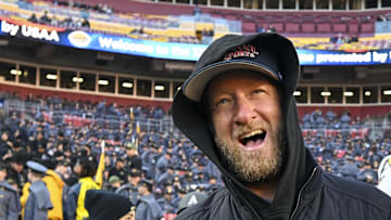 Dec 14, 2024; Landover, Maryland, USA;   Dave Portnoy, Bar Stool Sports  founder and owner  walks along the sidelines before the playing of the 125 Army Navy game at Commanders Field.