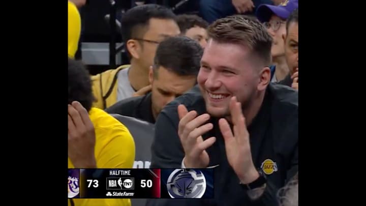 Luka Doncic reacts to an and-one from new teammate LeBron James