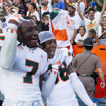 Miami Hurricanes defensive back Jaden Harris (7) and Miami Hurricanes defensive back Myles Mooyoung (38) celebrate during the season opener at Ben Hill Griffin Stadium in Gainesville, FL on Saturday, August 31, 2024 against the University of Miami Hurricanes. The Hurricanes defeated the Gators 41-17. [Doug Engle/Gainesville Sun]