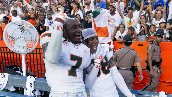 Miami Hurricanes defensive back Jaden Harris (7) and Miami Hurricanes defensive back Myles Mooyoung (38) celebrate during the season opener at Ben Hill Griffin Stadium in Gainesville, FL on Saturday, August 31, 2024 against the University of Miami Hurricanes. The Hurricanes defeated the Gators 41-17. [Doug Engle/Gainesville Sun]