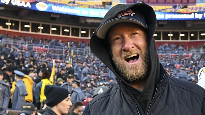 Dec 14, 2024; Landover, Maryland, USA;   Dave Portnoy, Barstool Sports founder and owner, walks along the sidelines before the playing of the 125th Army-Navy game.