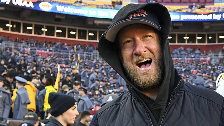Dec 14, 2024; Landover, Maryland, USA;   Dave Portnoy, Bar Stool Sports  founder and owner  walks along the sidelines before the playing of the 125 Army Navy game at Commanders Field. Mandatory Credit: Tommy Gilligan-Imagn Images

Dec 14, 2024; Landover, Maryland, USA;  Dave Portnoy poses with solders before the between the Army Black Knights and the Navy Midshipmen  at Commanders Field. Mandatory Credit: Tommy Gilligan-Imagn Images