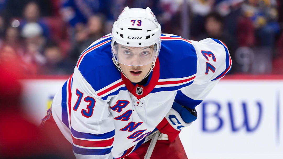 Mar 8, 2025; Ottawa, Ontario, CAN;  New York Rangers center Matt Rempe (73) gets in position for a faceoff in the second period against the  Ottawa Senators at the Canadian Tire Centre. Mandatory Credit: Marc DesRosiers-Imagn Images
