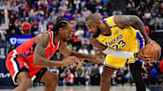 Feb 4, 2025; Inglewood, California, USA; Los Angeles Lakers forward LeBron James (23) controls the ball against Los Angeles Clippers forward Kawhi Leonard (2) during the second half at Intuit Dome. Mandatory Credit: Gary A. Vasquez-Imagn Images