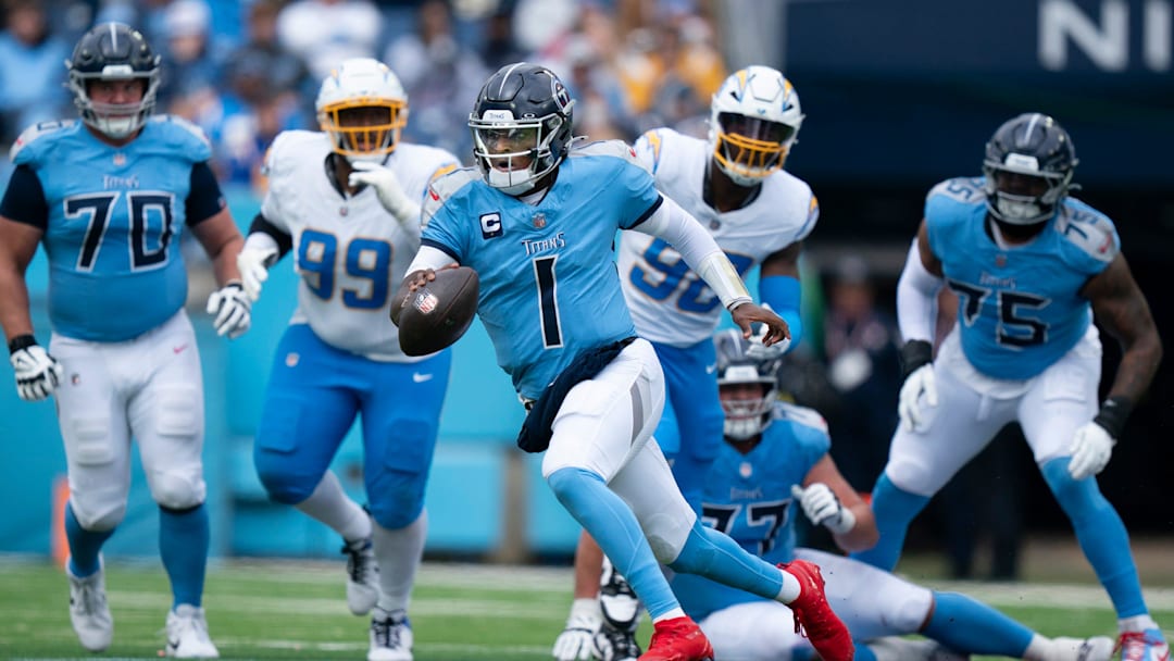 Tennessee quarterback Cam Ward (1) scrambles away from the Los Angeles defense during their game at Nissan Stadium in Nashville, Tenn., Sunday, Nov. 2, 2025.