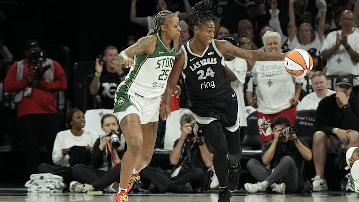 Sep 14, 2025; Las Vegas, Nevada, USA; Las Vegas Aces guard Jewell Loyd (24) dribbles against Seattle Storm guard Tiffany Mitchell (25) in the first quarter during game one of round one for the 2025 WNBA Playoffs at Michelob Ultra Arena. Mandatory Credit: Candice Ward-Imagn Images