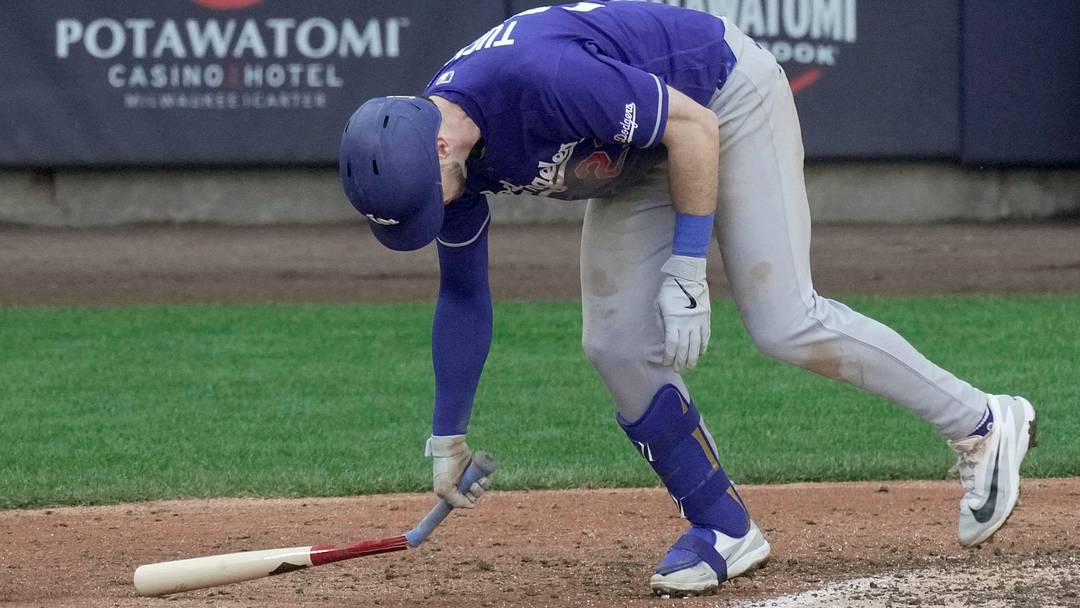 Los Angeles Dodgers right fielder Kyle Tucker (23) breaks his bat after flying out with two runners win base during the ninth inning of their game Sunday, May 24, 2026 at American Family Field in Milwaukee, Wisconsin.