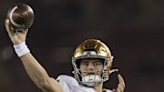 Nov 29, 2025; Stanford, California, USA;  Notre Dame Fighting Irish quarterback CJ Carr (13) warms up before the start of the first quarter against the Stanford Cardinal at Stanford Stadium. 