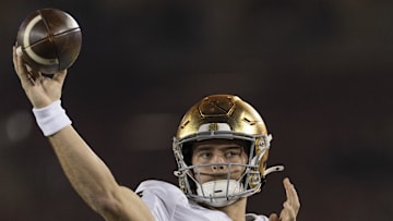 Nov 29, 2025; Stanford, California, USA;  Notre Dame Fighting Irish quarterback CJ Carr (13) warms up before the start of the first quarter against the Stanford Cardinal at Stanford Stadium. 