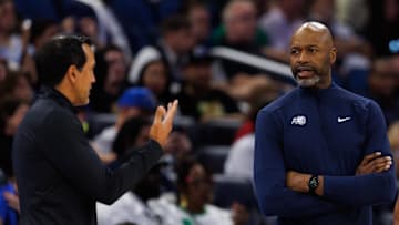 Oct 12, 2025; Orlando, Florida, USA; Miami Heat Head Coach Erik Spoelstra, Orlando Magic Head Coach Jamahl Mosley and NBA referee Robert Hussey react during a free throw during the first half at Kia Center. Mandatory Credit: Matt Pendleton-Imagn Images