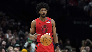Dec 30, 2024; Portland, Oregon, USA; Portland Trail Blazers guard Scoot Henderson (00) handles the ball during the second half against the Philadelphia 76ers at Moda Center. Mandatory Credit: Soobum Im-Imagn Images