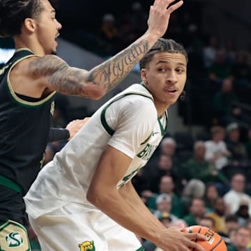 Dec 2, 2025; Waco, Texas, USA; Baylor Bears guard Cameron Carr (43) looks to pass against Sacramento State Hornets guard Jahni Summers (4) during the first half at Paul and Alejandra Foster Pavilion. Mandatory Credit: Chris Jones-Imagn Images