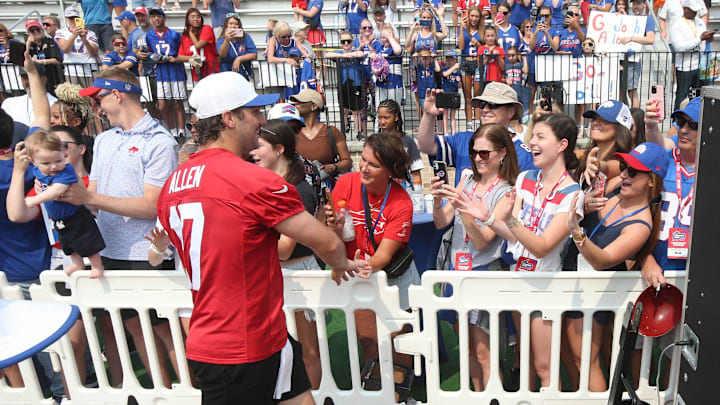 Bills quarterback Josh Allen runs the perimeter of the practice field high-fiving fans after practice during the final day of Buffalo Bills training camp at St. John Fisher University Thursday, August 7, 2025 in Pittsford, NY.